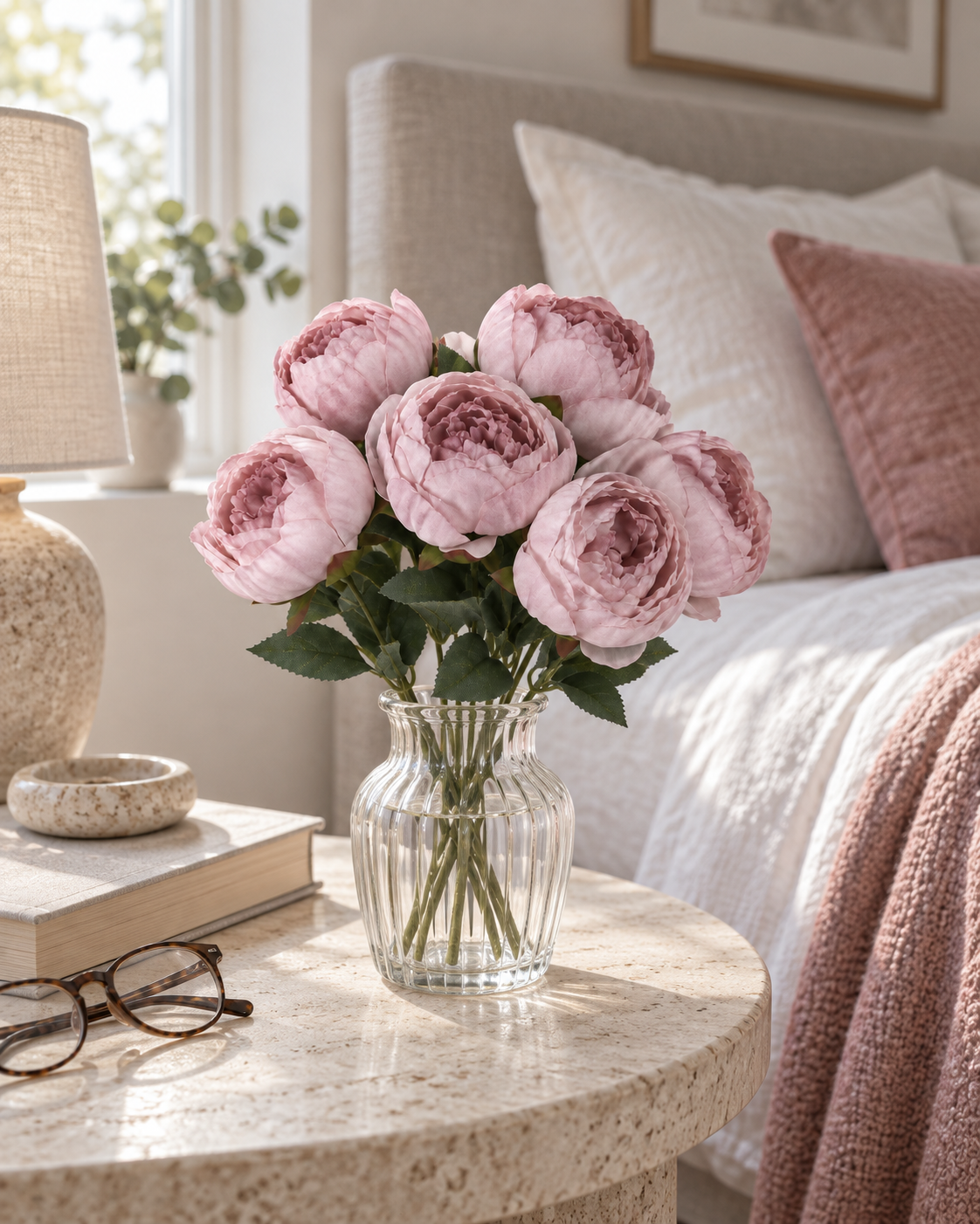 Peony-Style Garden Rose Bouquet — Pink — styled in a glass vase on a bedside table
