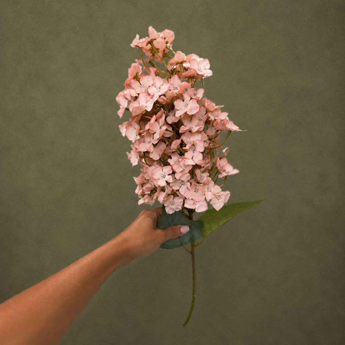 artificial elongated hydrangea stem white 31 5 faux bloom for weddings events lifestyle scene: florist arranging stem
