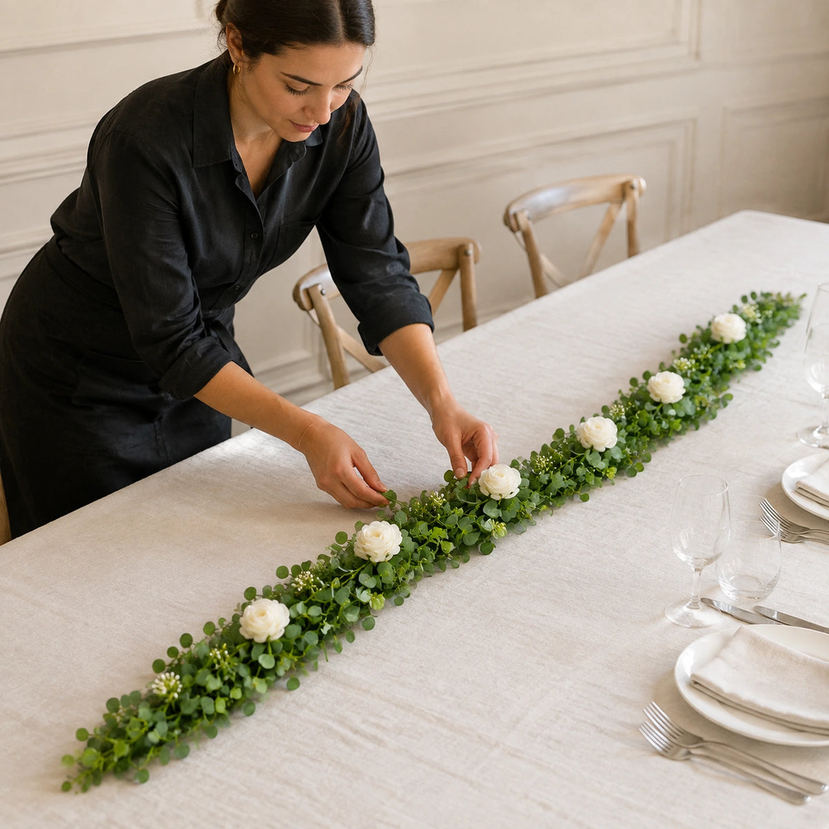 cream rose eucalyptus floral garland 2m lifestyle scene: florist installing garland