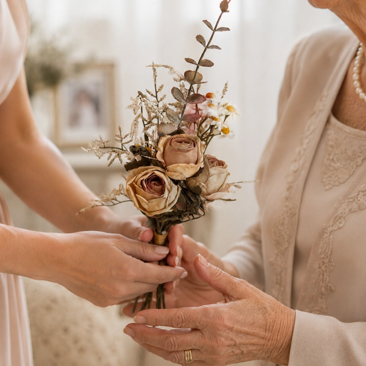 pink burgundy premium floral bouquet luxury pre arranged artificial centerpiece lifestyle scene: person carrying or gifting bouquet