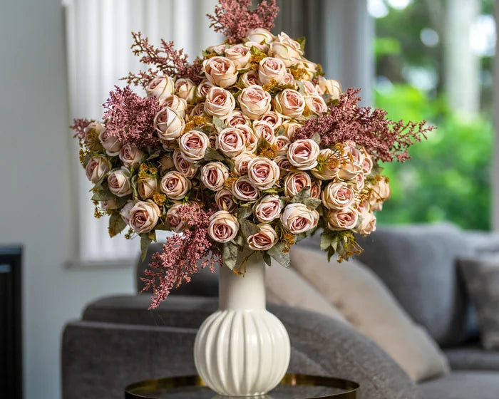 Blush rose arrangement in a living room