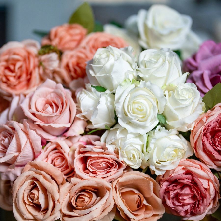 Close-up of ivory, blush and peach rose petals