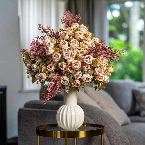 Blush rose arrangement in a living room